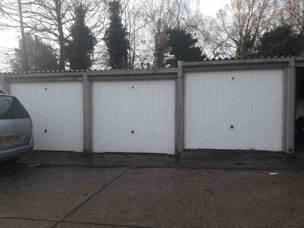 battery garages with grey car in front