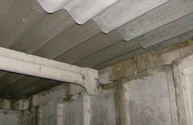 Inside the concrete battery garage there are more hazards, in particular cracking purlins that support the roof.